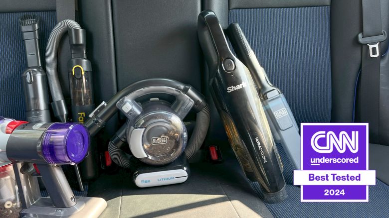 Multiple types of car vacuums on car seat.