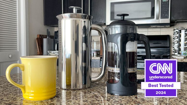 Two Espro French presses and a yellow mug on a kitchen counter.