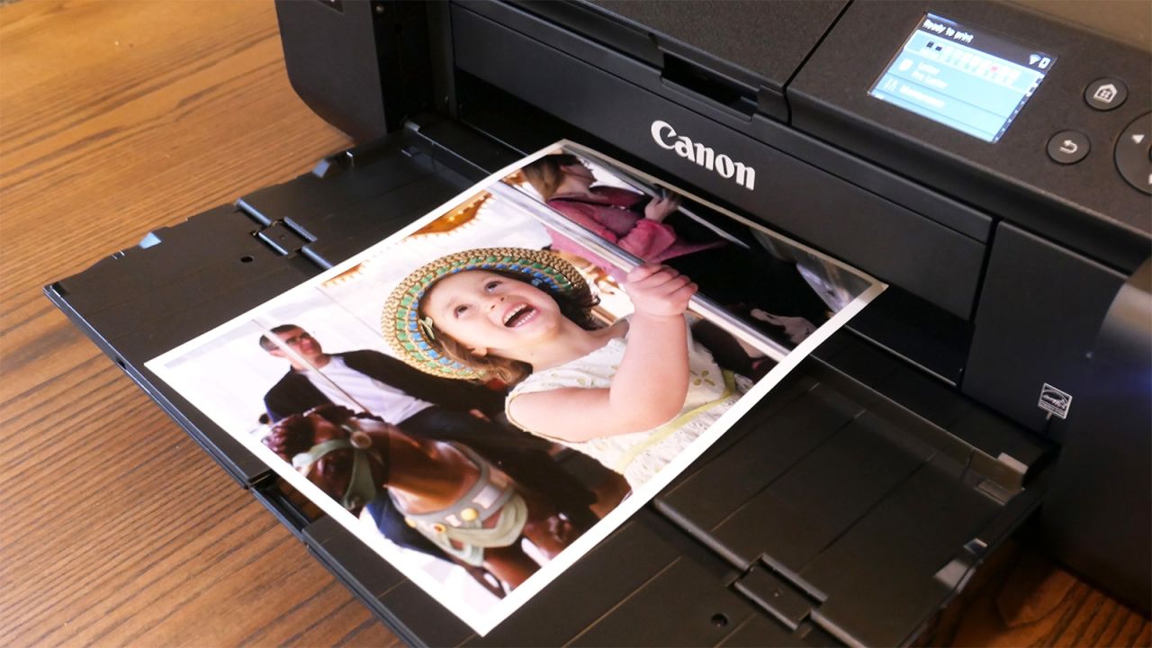 a Canon photo printer outputting a color print