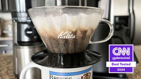 A Kalita Wave 185 pour over coffee brewer on a mug.