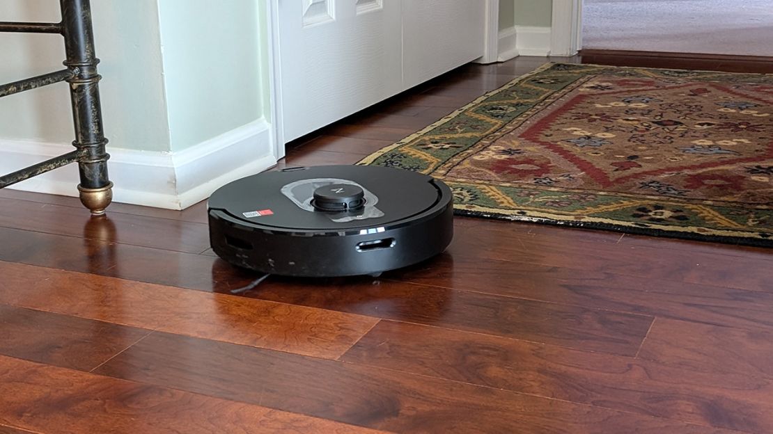 best robot vacuum the roborock on a wood floor near an area rug