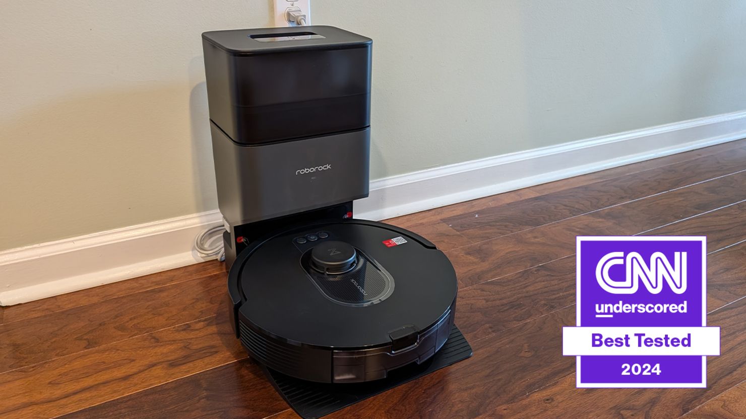 best robot vacuum the roborock in its charging base on wood floor