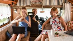 Family browses the web in a recreational vehicle.