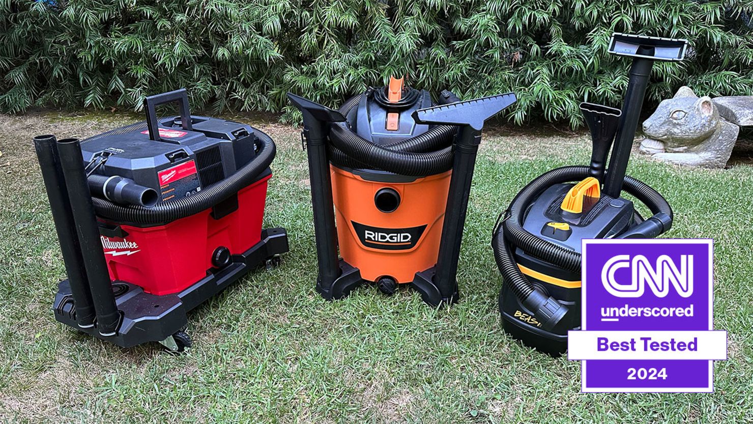 Three of CNN Underscored's best tested shop vacs on a grass lawn.