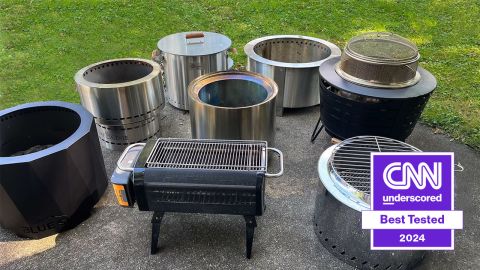 Eight smokeless fire pits are collected on a backyard patio.