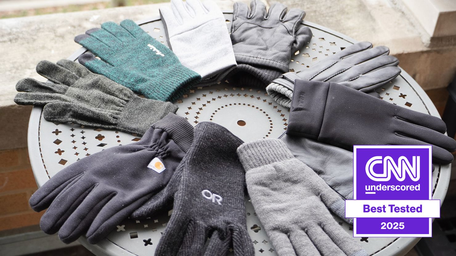 touchscreen gloves on a round table outside