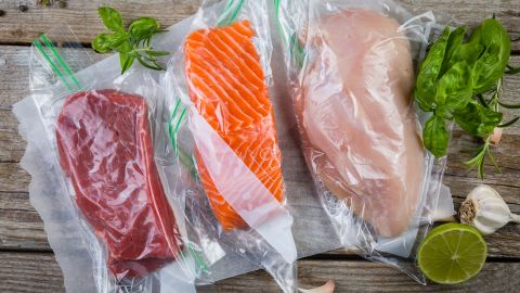 Beef, salmon and chicken breast in vacuum-sealed bags for sous vide cooking.
