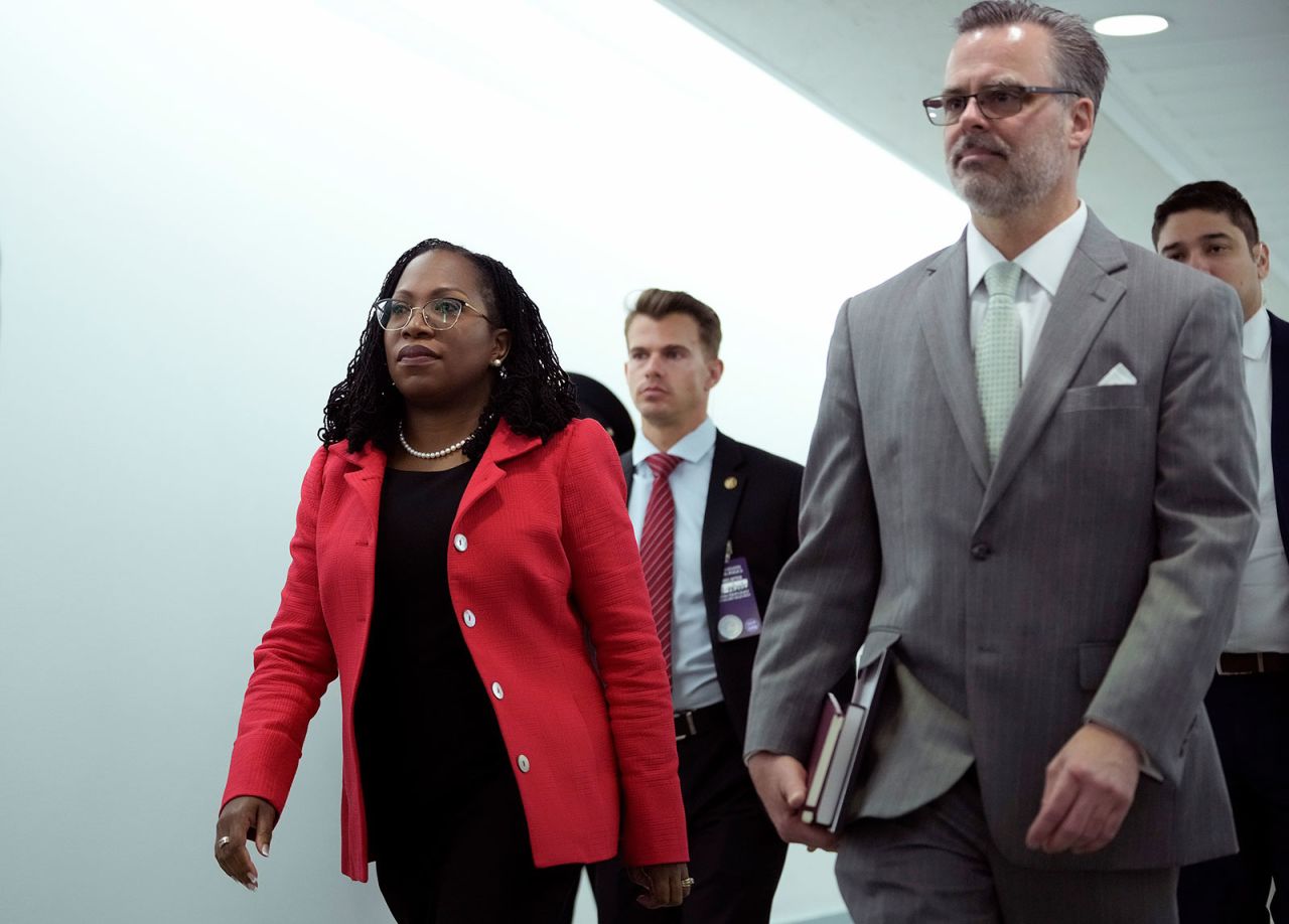 Judge Ketanji Brown Jackson, left, arrives with her husband Patrick on Tuesday.