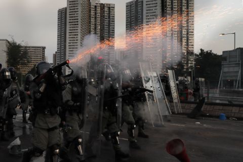 Riot police fire tear gas during a confrontation with protesters on August 5.