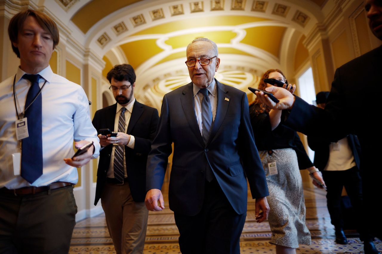 Senate Majority Leader Charles Schumer talks to reporters as he walks to his office at the US Capitol on Wednesday in Washington, DC.