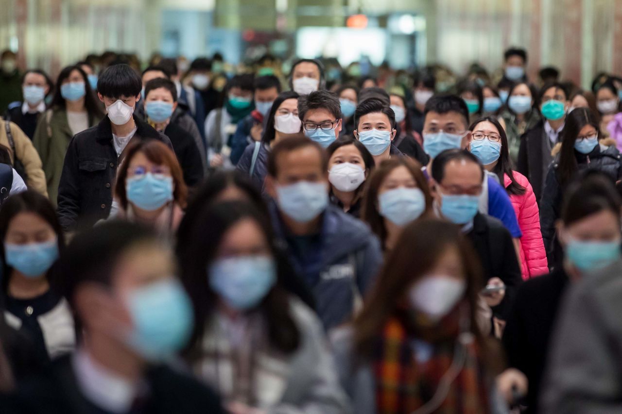 Commuters wear protective masks in Hong Kong, China, on Wednesday.