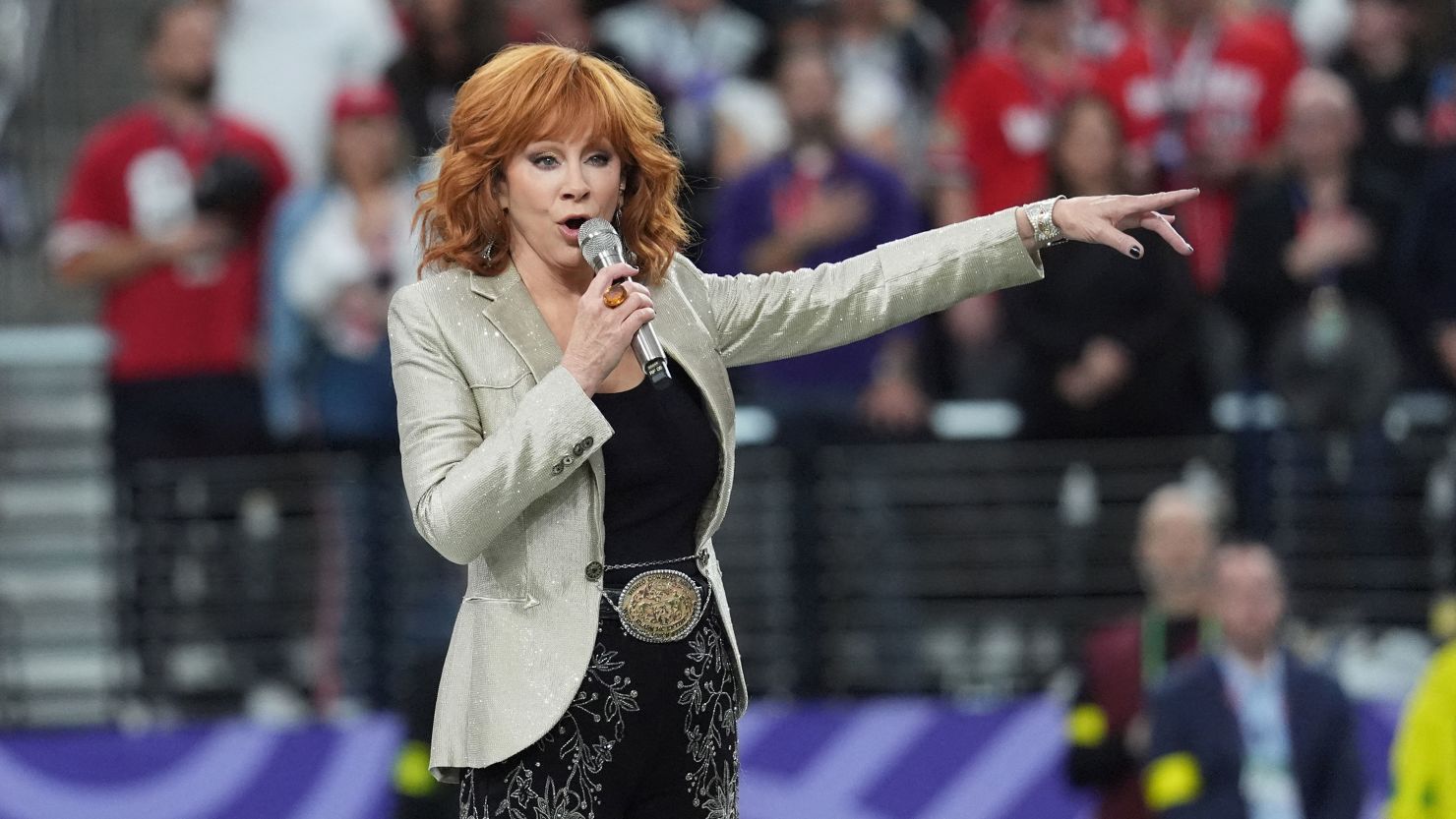 Reba McEntire sings the National Anthem ahead of the Super Bowl on Sunday.
