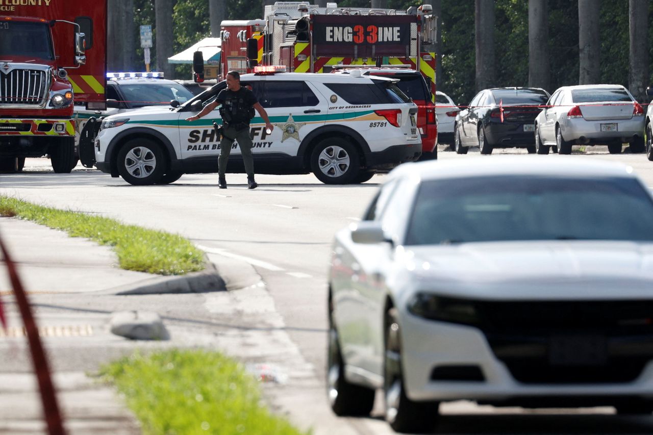 Law enforcement investigates reports of shots fired outside Trump International Golf Club in West Palm Beach, Florida, on Sunday. 