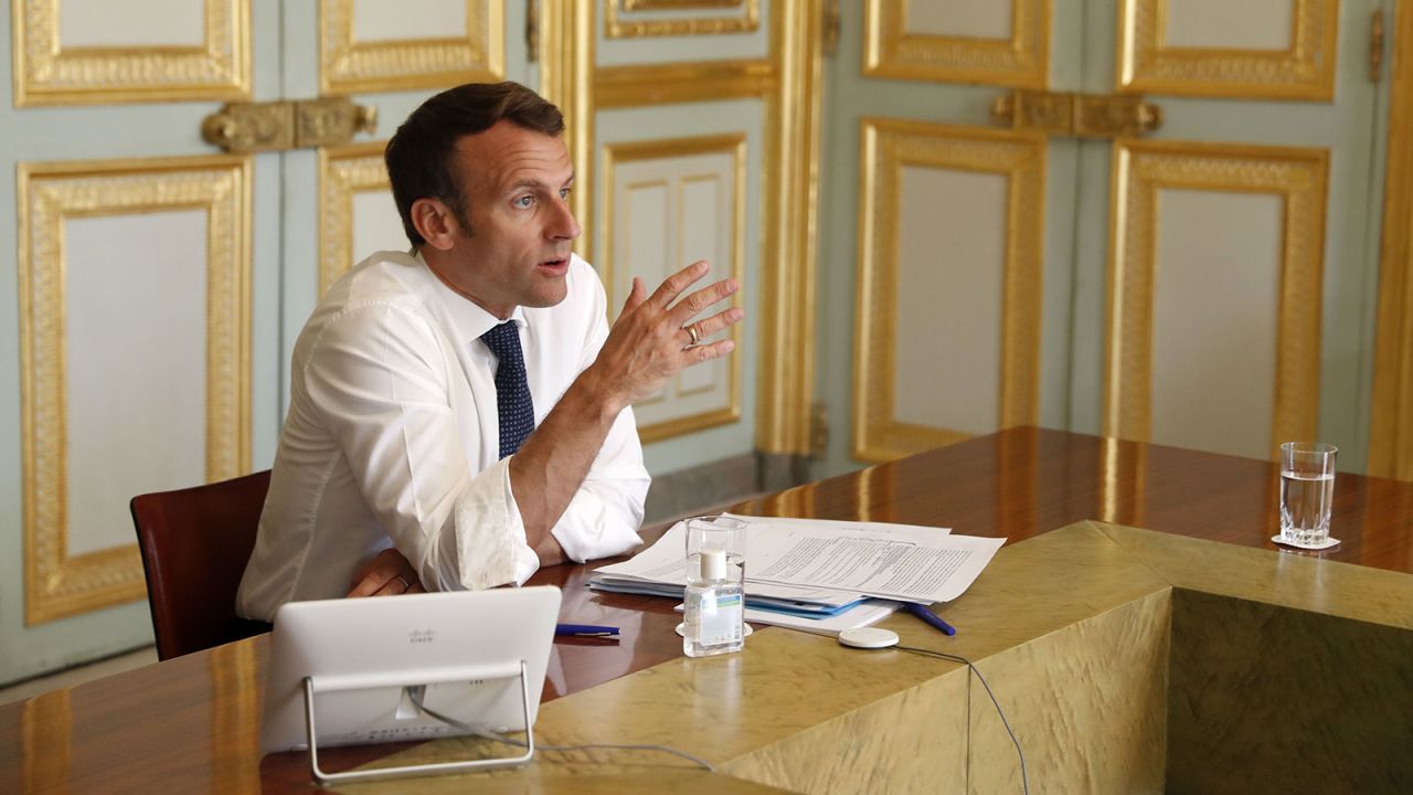 French President Emmanuel Macron attends a video conference call with the president of the Research and Expertise Analysis Committee at the Elysee Palace in Paris on April 16.