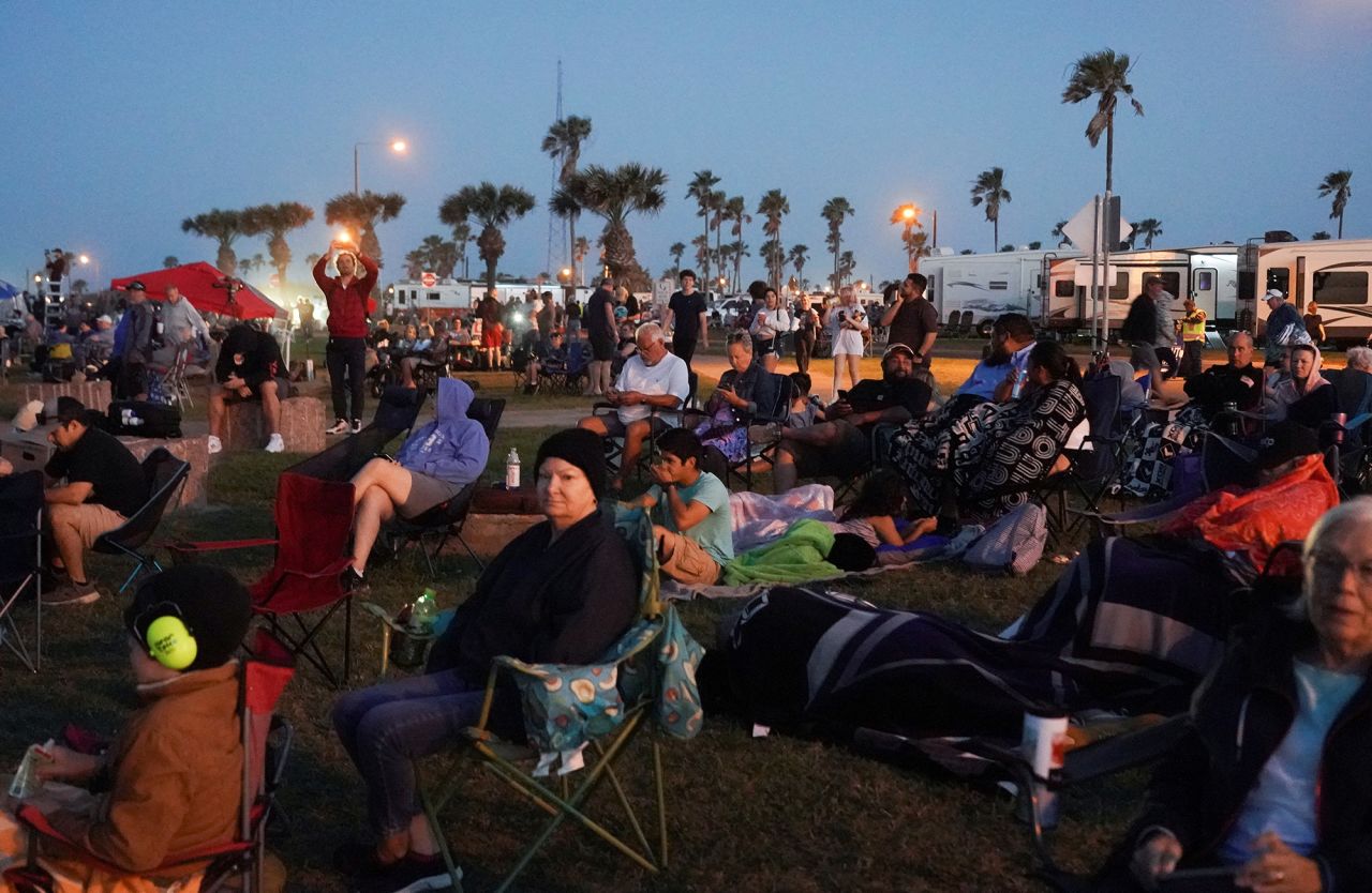 People gather before SpaceX's Starship lifts off from the company's Boca Chica launchpad on an orbital test mission near Brownsville, Texas, on Monday, April 17.