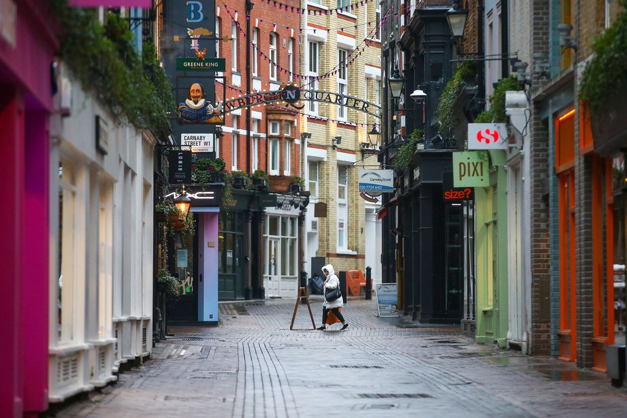 A pedestrian passes closed shops on Carnaby Street in London on Tuesday, January 5.