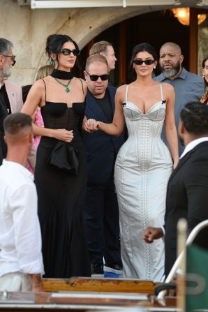 Kendall and Kylie Jenner leave for the wedding ceremony on Friday.