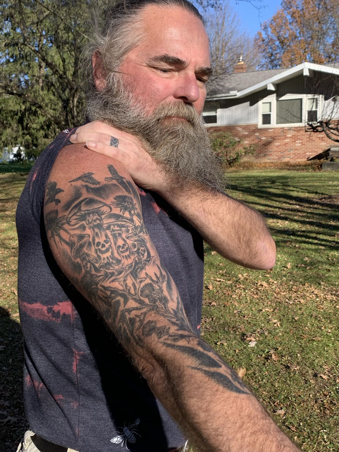 William D. Hickman's tattoo starts where doctors injected him with an antidote and ends of the mushrooms he ate and the milk thistle plant that saved him.