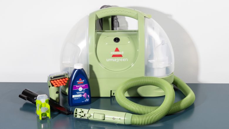 The Bissell Little Green Portable Carpet Cleaner and its attachments.