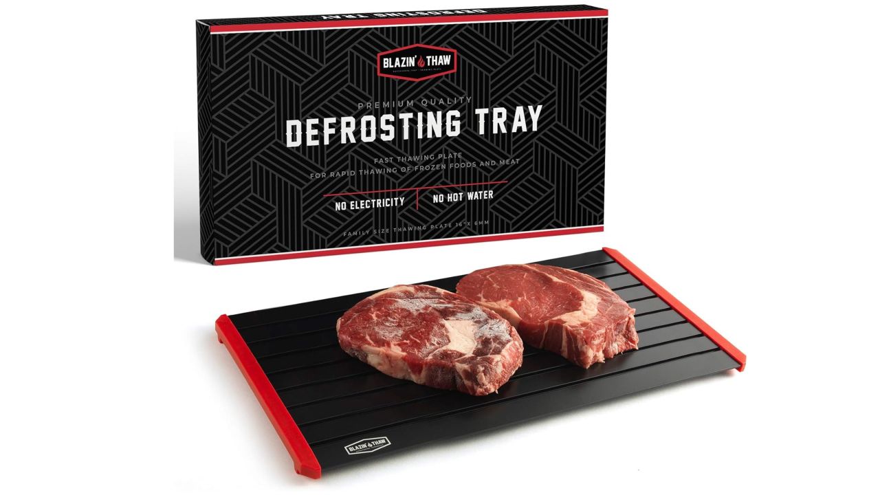 Blazin' House defrosting tray with two pieces of meat on it