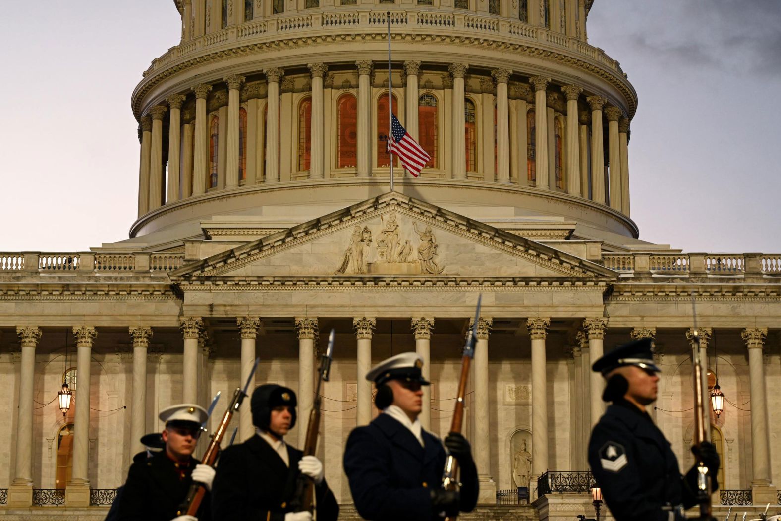 Military personnel leave the Capitol after Carter's casket arrived on January 7.