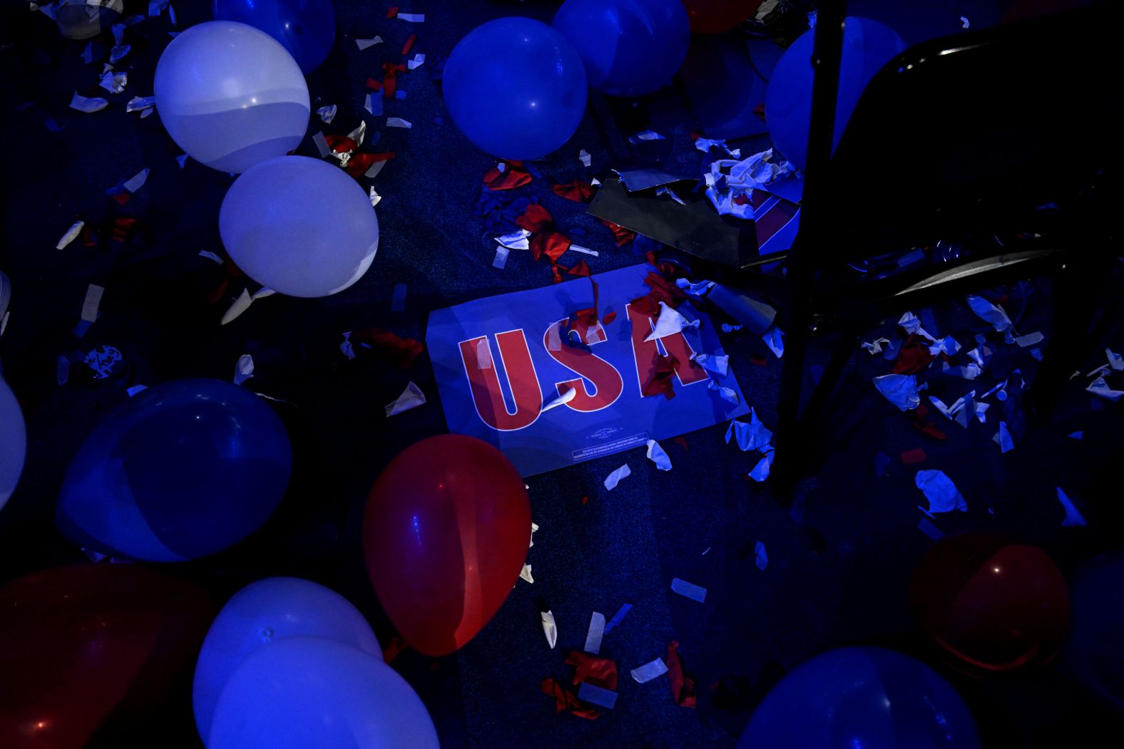 Balloons and signs lie on the floor of the United Center at the end of the convention.