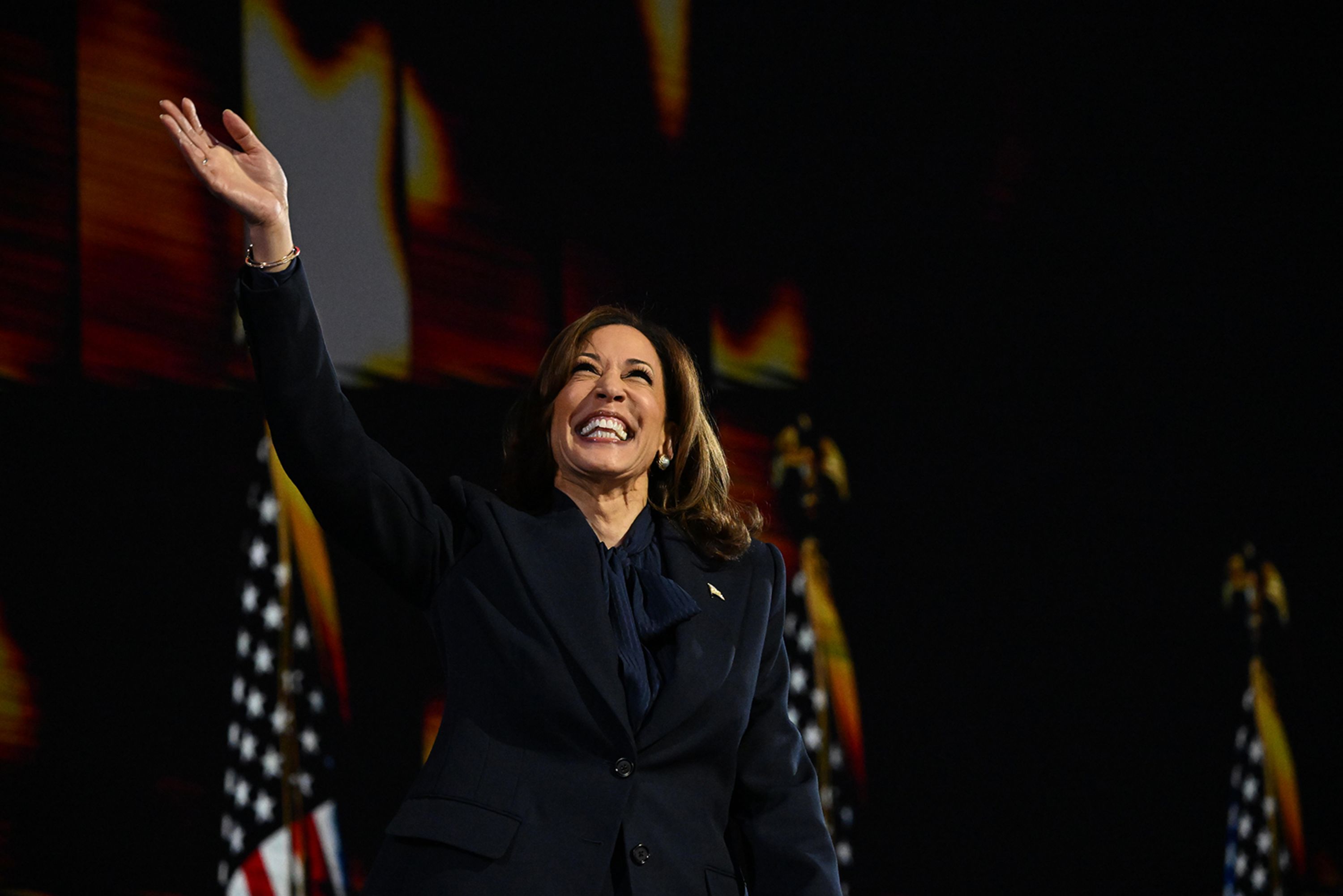 US Vice President Kamala Harris waves as she takes the stage for her speech at the <a >Democratic National Convention</a> on Thursday, August 22.