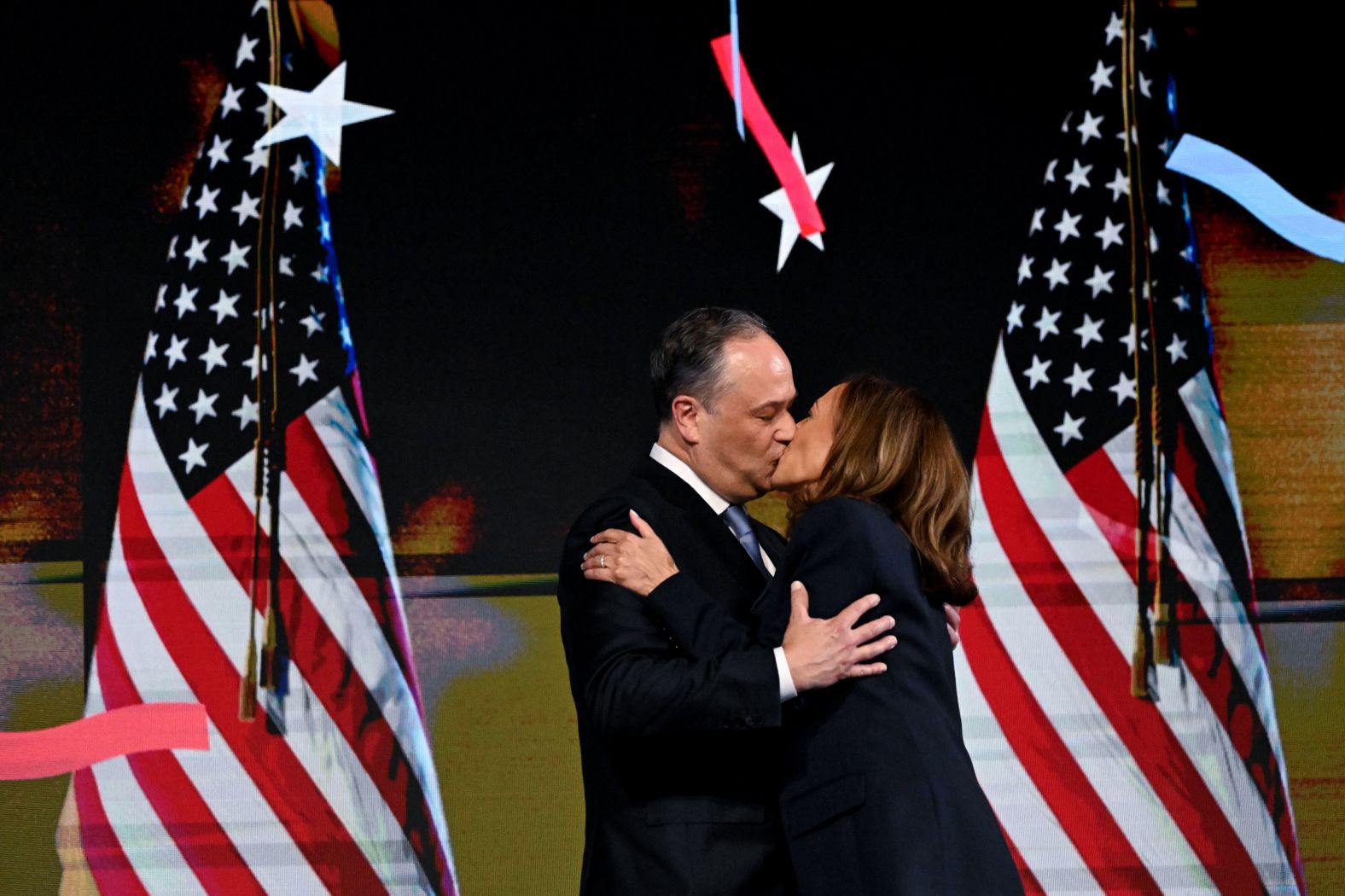 Harris kisses her husband, Doug Emhoff, after her speech. Thursday was also their 10th wedding anniversary.