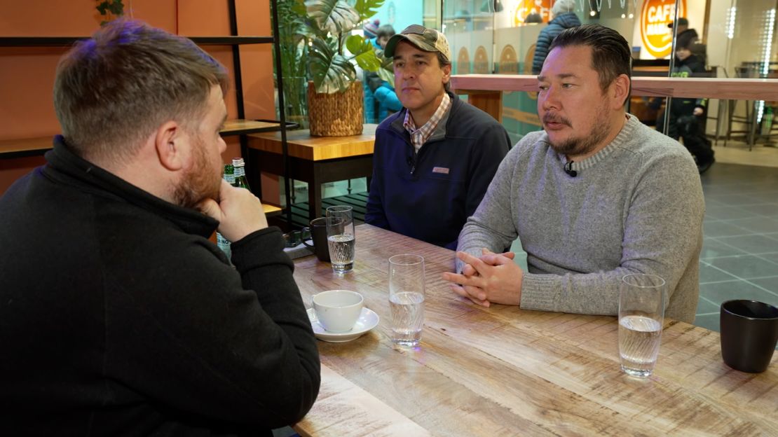 Jørgen Boassen, right, has become known as Greenland's biggest fan of President Trump. Here he talks with Tom Dans, center, and CNN's Donie O'Sullivan.