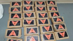 Samuel Briggs II, the acting chief patrol agent of the US Border Patrol's Miami sector, posted images of 25 packages of cocaine (70 lbs.) found on a beach in the Florida Keys.