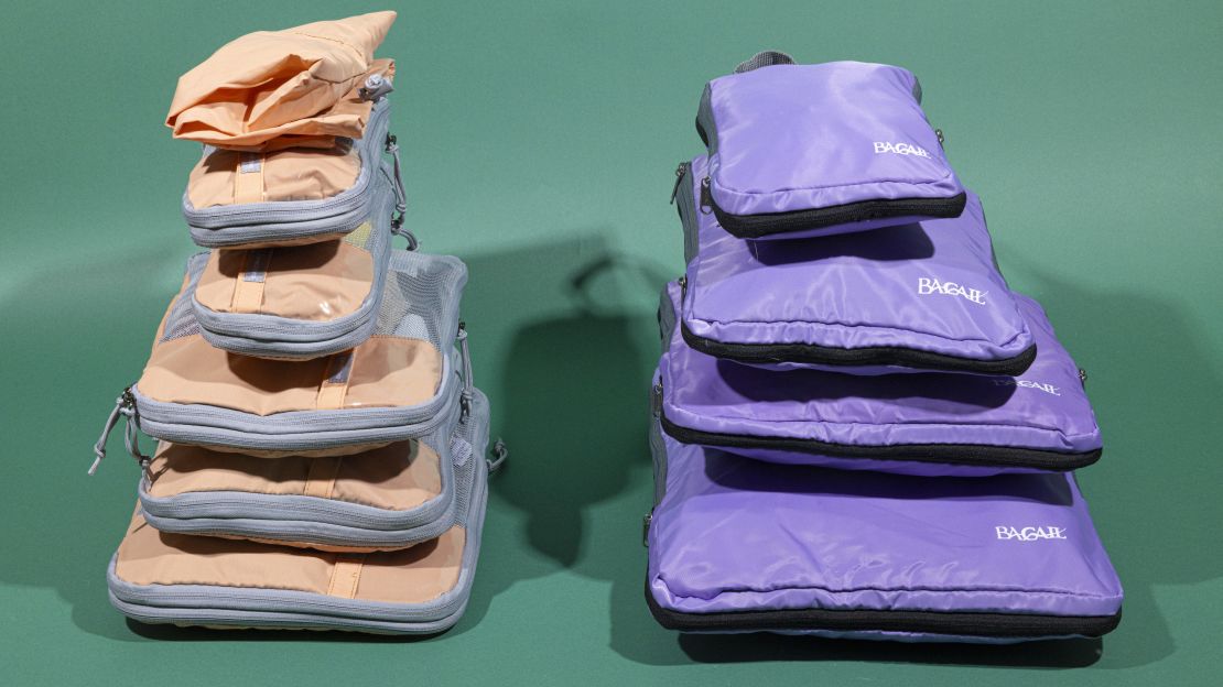 A photo of a set Bagsmart and Bagail packing cubes side-by-side