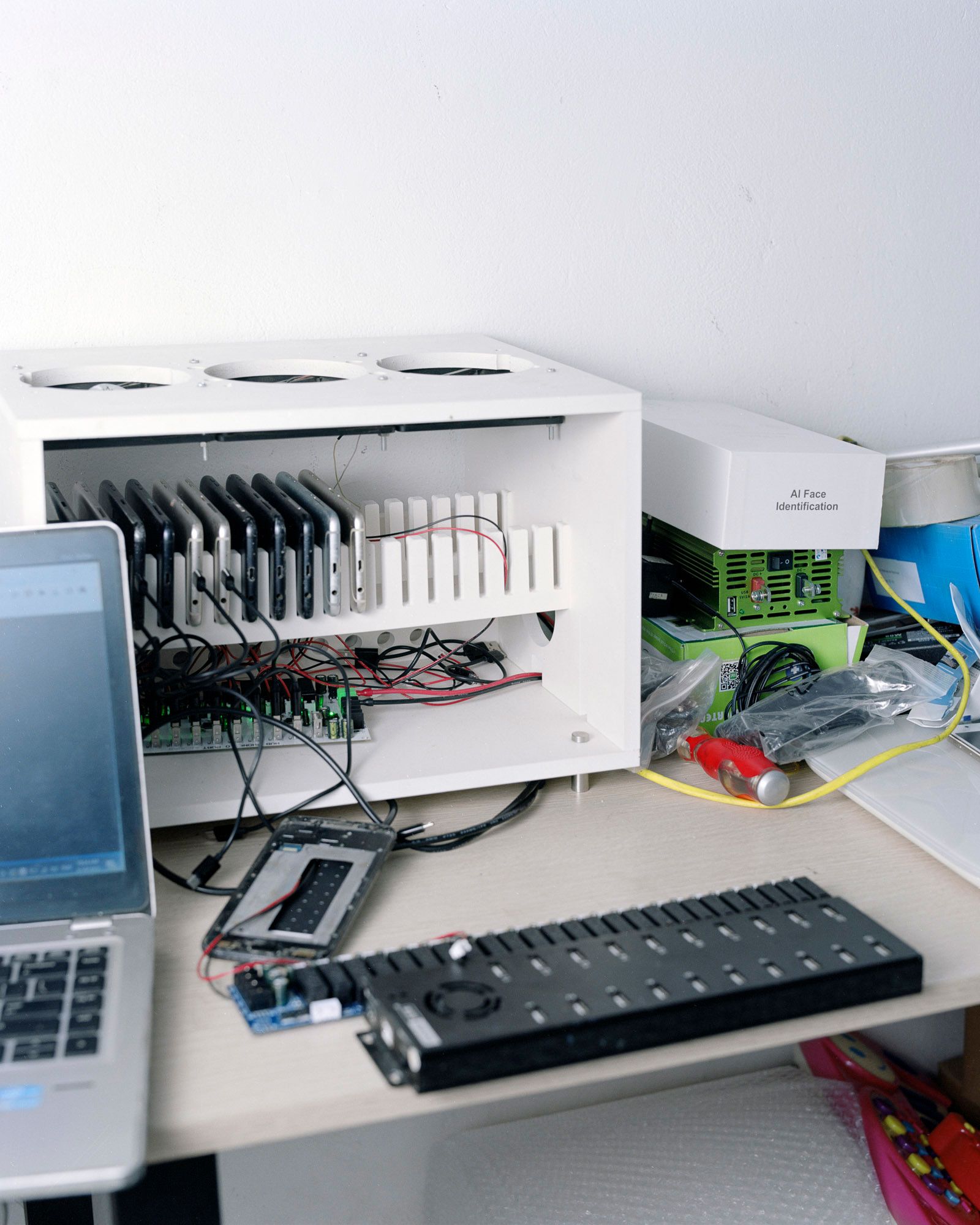 “Box farms,” a phrase used by the click farmers Latham visited, see several phones wired together and linked to a computer interface.