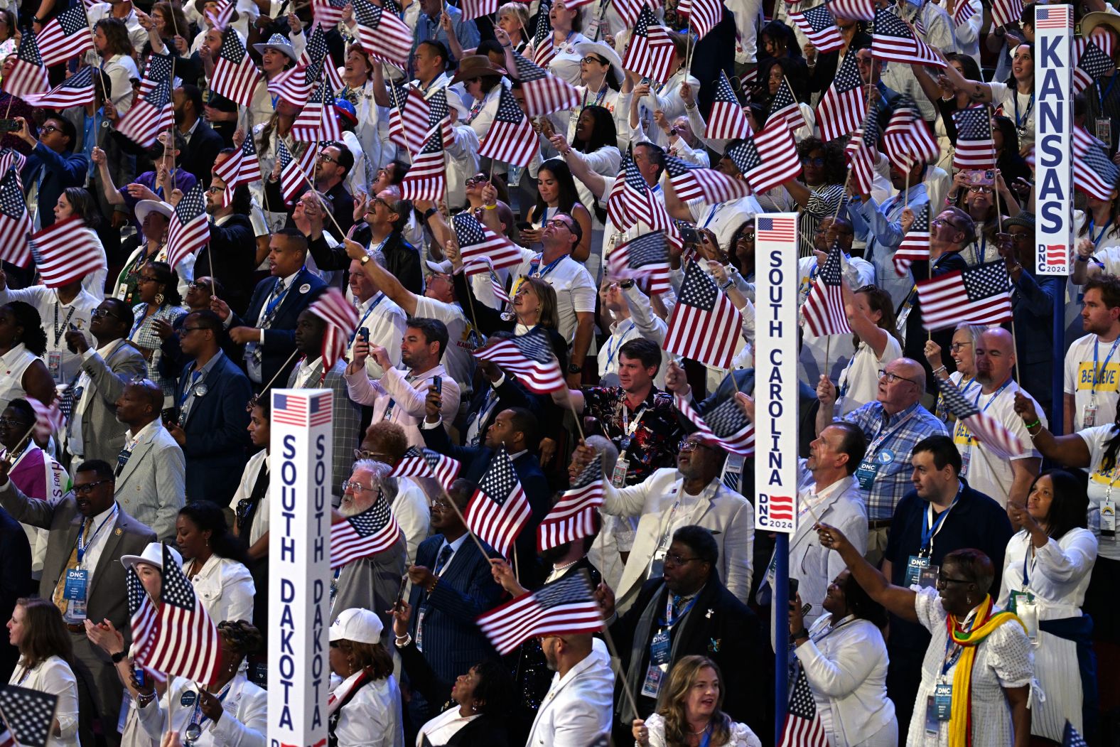 Delegates wave American flags on the convention floor Thursday.