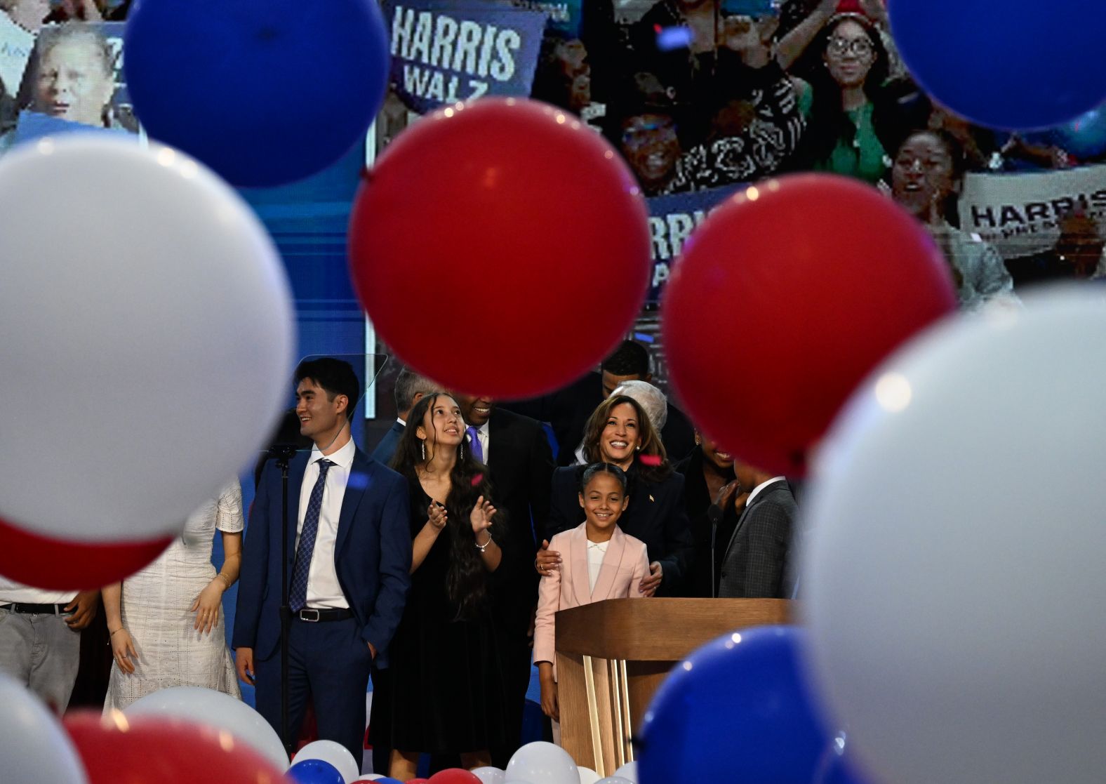 Harris is joined by more family members on stage after her speech on Thursday.