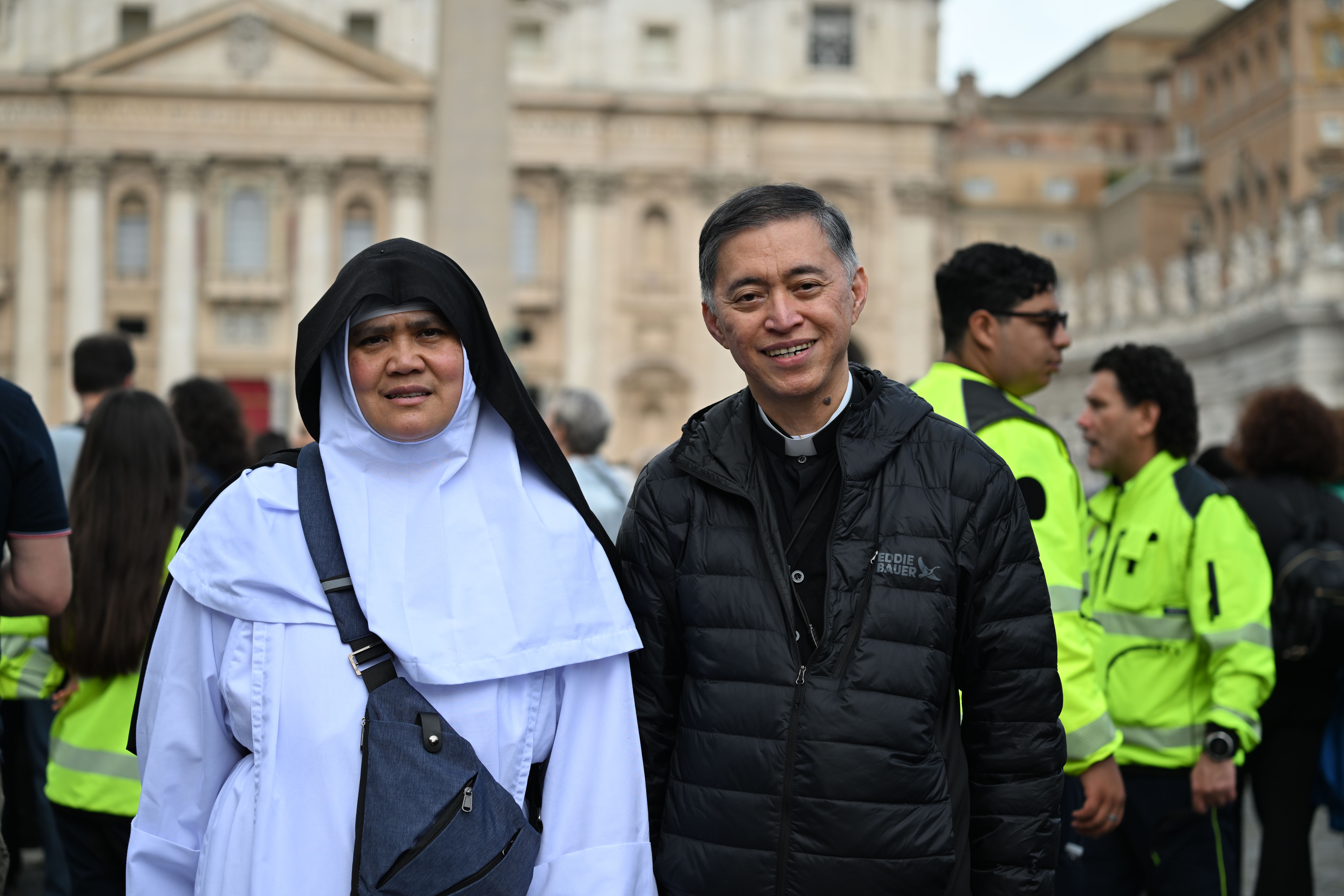 Father Ronald Ignacio, based in Rome, poses with Sister Mary Martha from Orange County, California, at the Vatican on Thursday. Ignacio, who has photos of himself with Pope Francis and cardinals Luis Tagle and Pablo David, is overjoyed to have two Filipino cardinals <a href="https://www.cnn.com/2025/04/22/world/pope-francis-successor-frontrunners-intl-dg/index.html">in the running to be the next pope</a>.