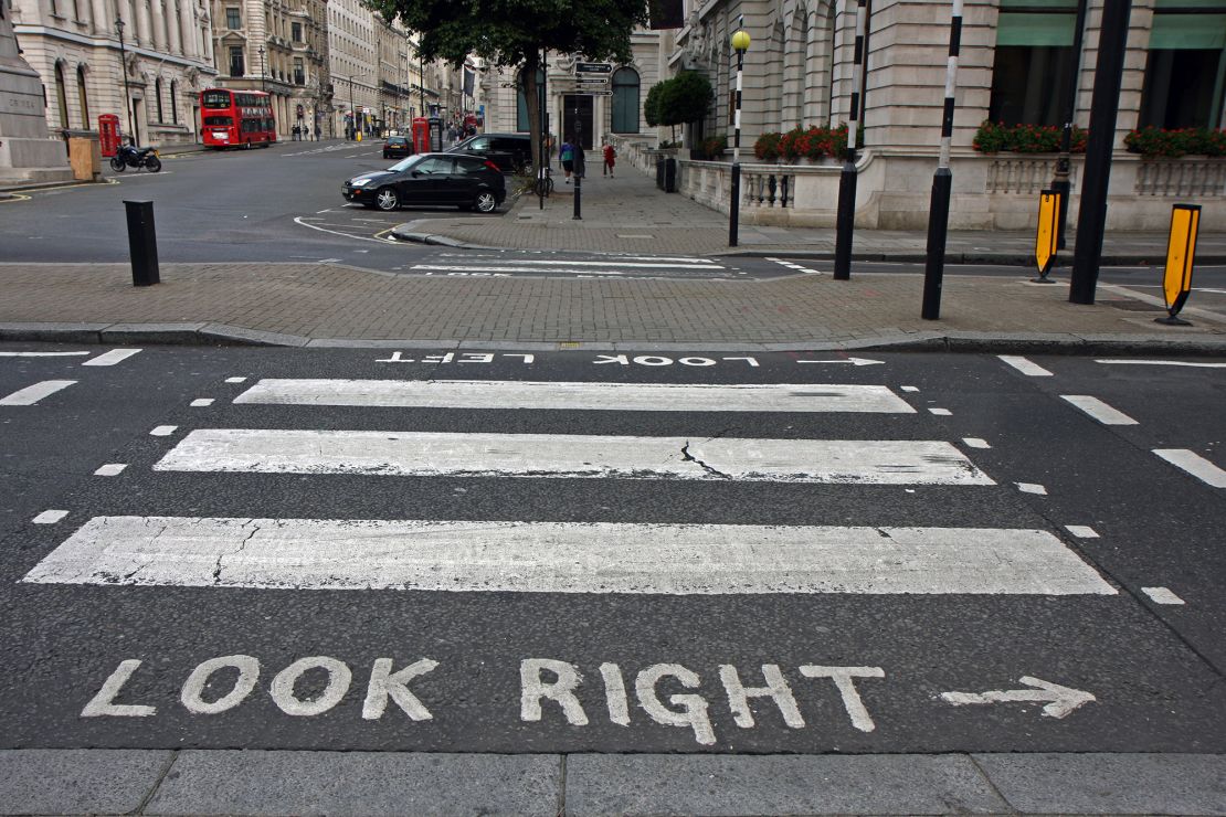 Pedestrian crossings in London, England, in September 2009. People visiting from other countries might have to remember to look for traffic coming from the opposite direction than they're accustomed to. Avis gives out bracelets to remind car renters which side to take.