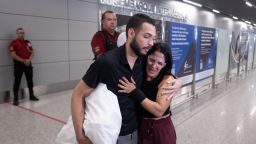 Luis Antonio Rodrigues Santos is welcomed by Eliana Campos after being deported from US arrive at Confins International Airport in Confins, Minas Gerais state, Brazil on January 25, 2025. Brazil on January 25 condemned the "disregard for fundamental rights" of nearly 80 Brazilian illegal migrants deported from the US who were handcuffed during the journey. The plane landed in Manaus due to technical problems. (Photo by Douglas MAGNO / AFP) (Photo by DOUGLAS MAGNO/AFP via Getty Images)