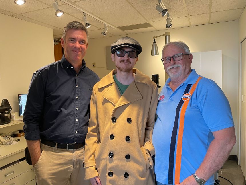 Brent and his father, Phil Chapman, with Dr. Greg Moloney (left).