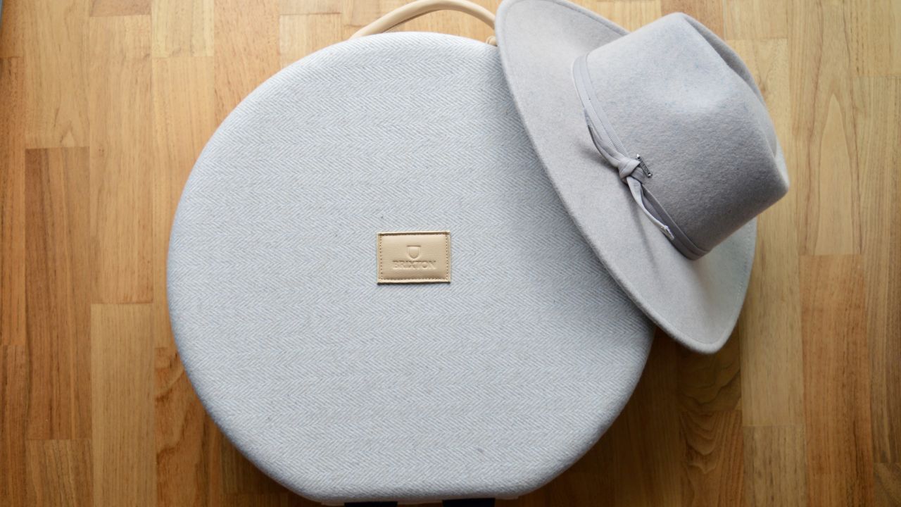 A photo of a Brixton hat and a Brixton hat case