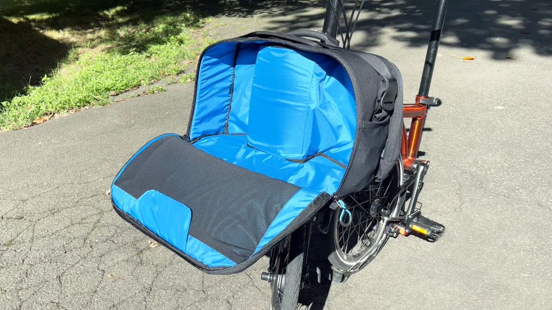 Even in the bigger of the currently available electric-compatible Brompton bags, the battery compartment takes up a good portion of the available capacity.