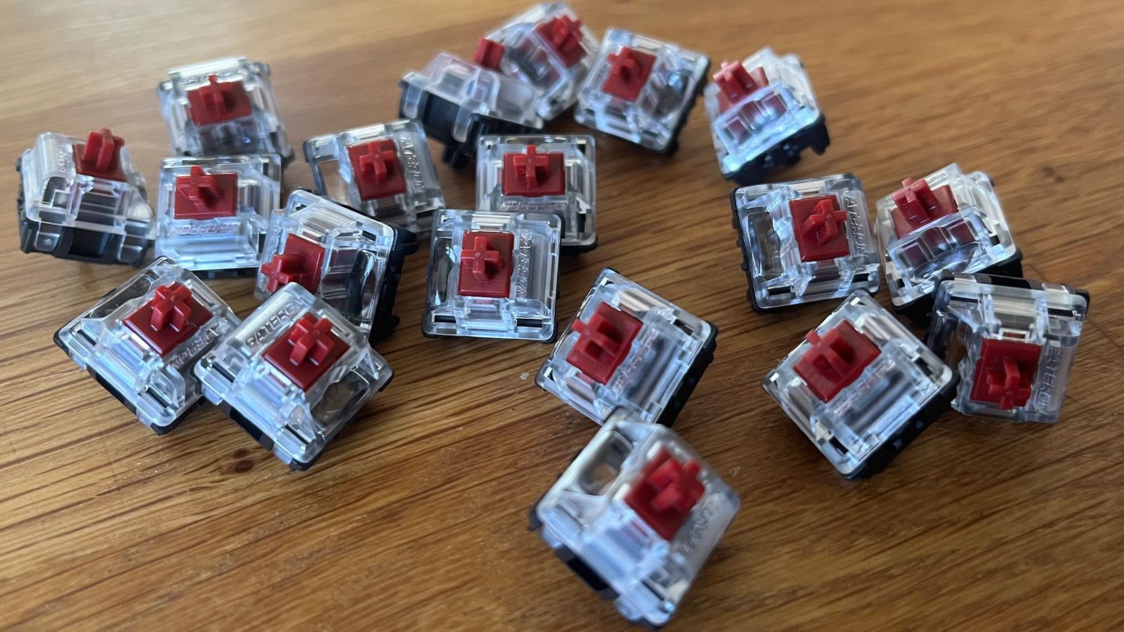 A group of mechanical keyboard switches, of the tactile "brown" type.