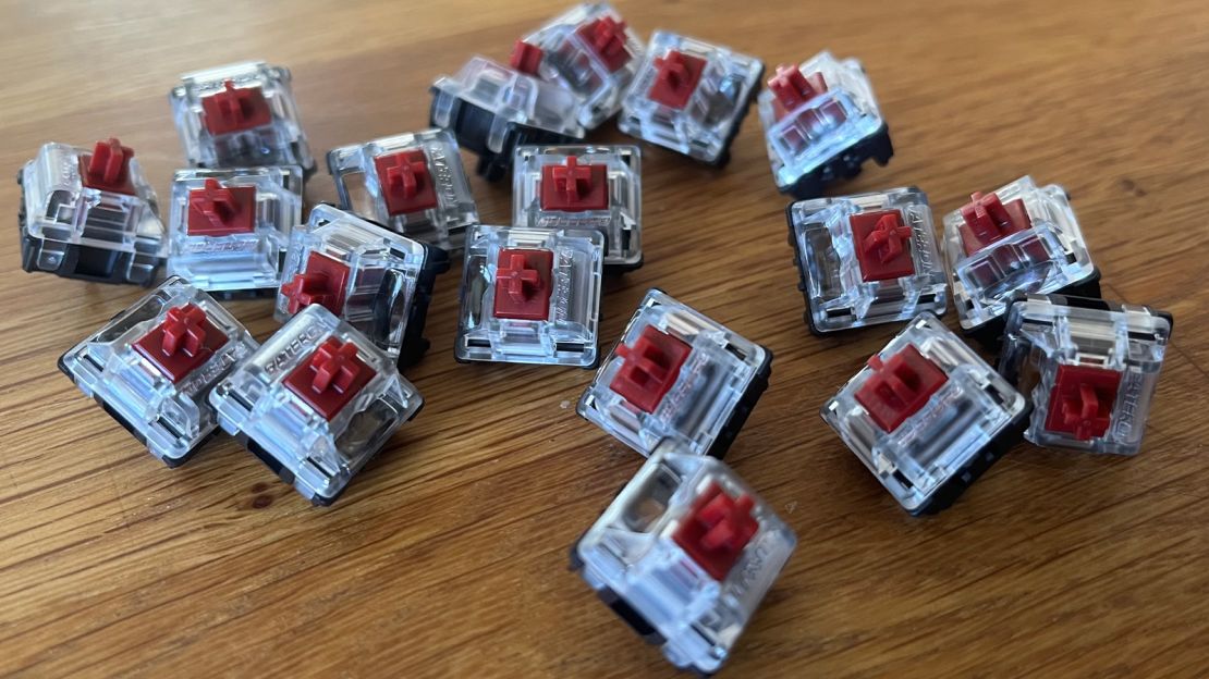 A group of mechanical keyboard switches, of the tactile "brown" type.