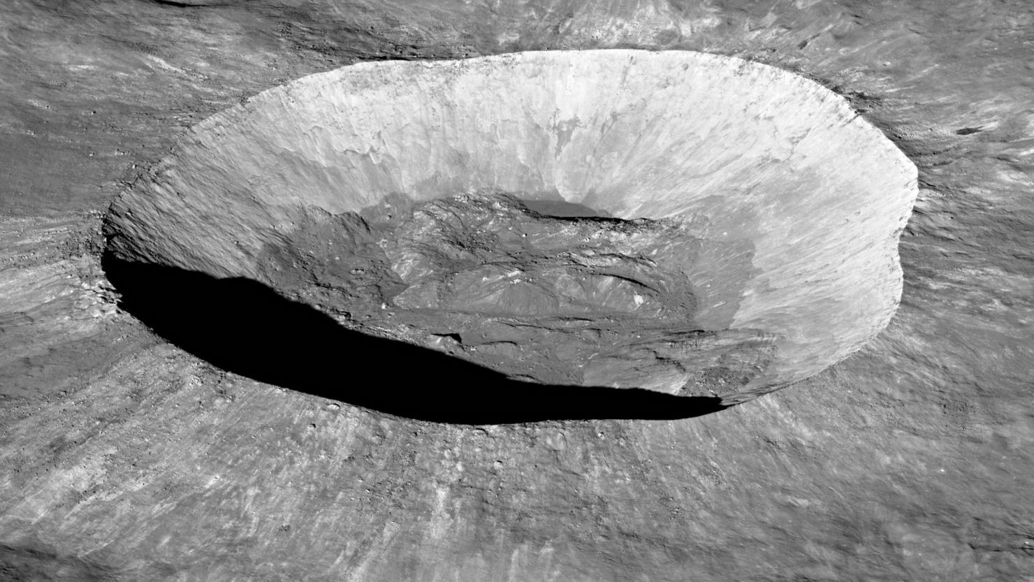 NASA's Lunar Reconnaissance Orbiter captured an image of the Giordano Bruno crater on the moon's far side, showcasing the height and sharpness of the rim as well as rolling hills along the crater floor.