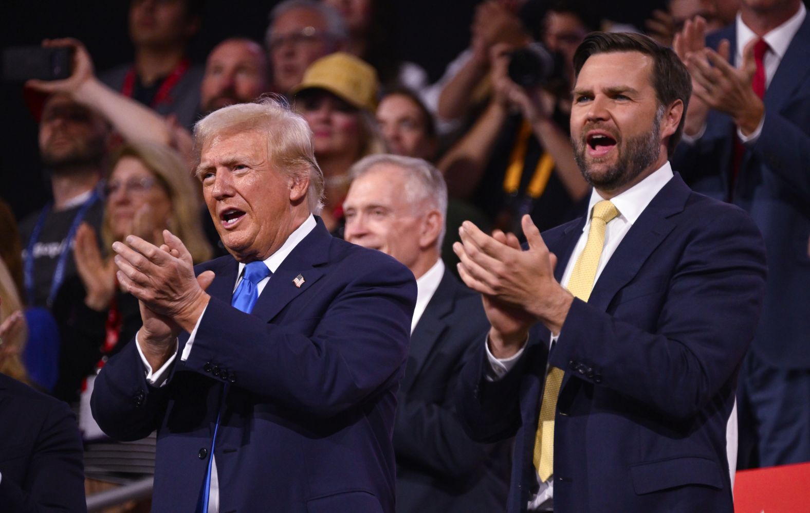 Trump and Vance applaud on Tuesday.