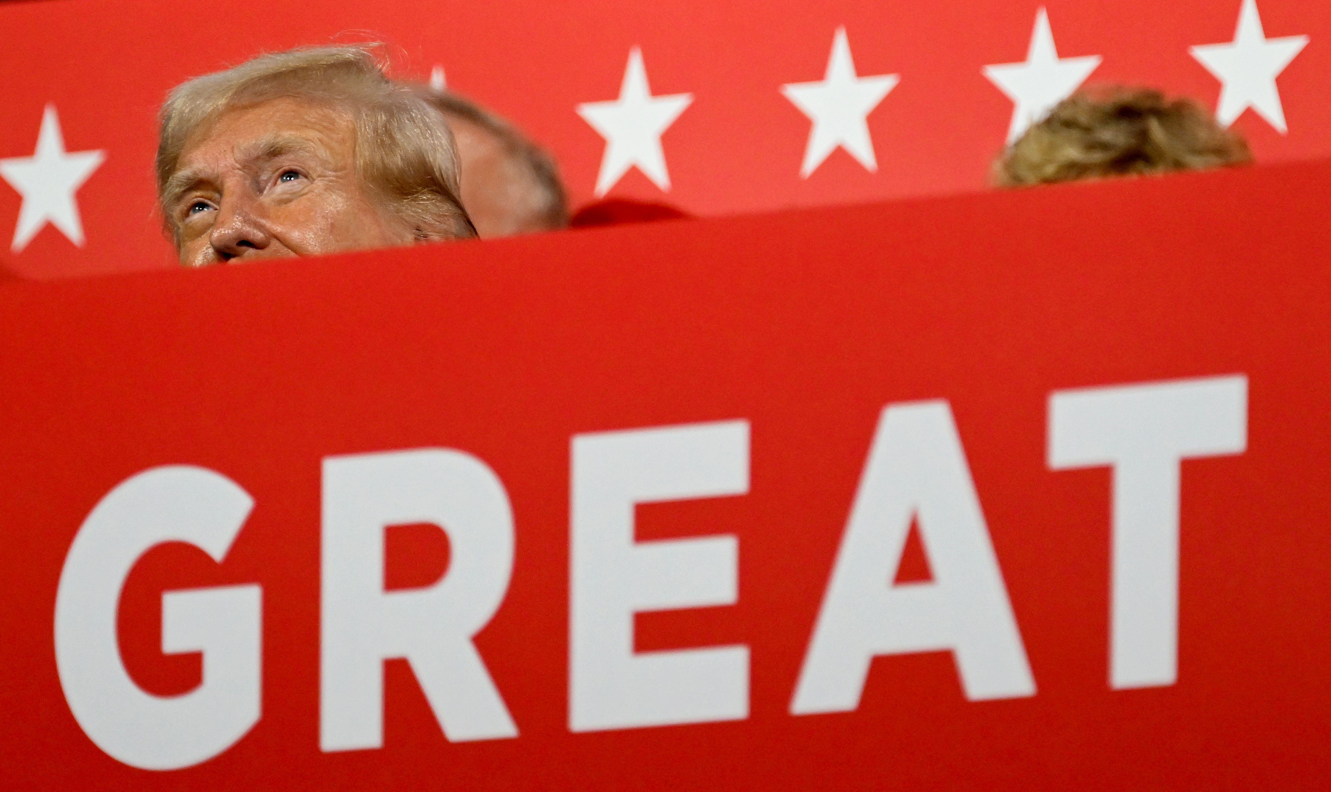 Former US President Donald Trump takes in the events of the <a href="https://www.cnn.com/2024/07/15/politics/gallery/republican-national-convention/index.html">Republican National Convention</a> on Tuesday, July 16.