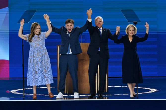 Minnesota Gov. Tim Walz is joined by his daughter, Hope; his son, Gus; and his wife, Gwen, at the Democratic National Convention in Chicago on Wednesday, August 21.