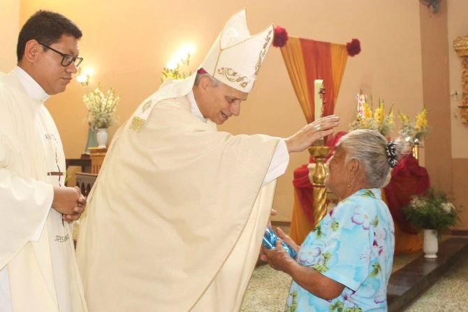 Leo blesses a woman during a Mass in Motupe, Peru, in 2020.