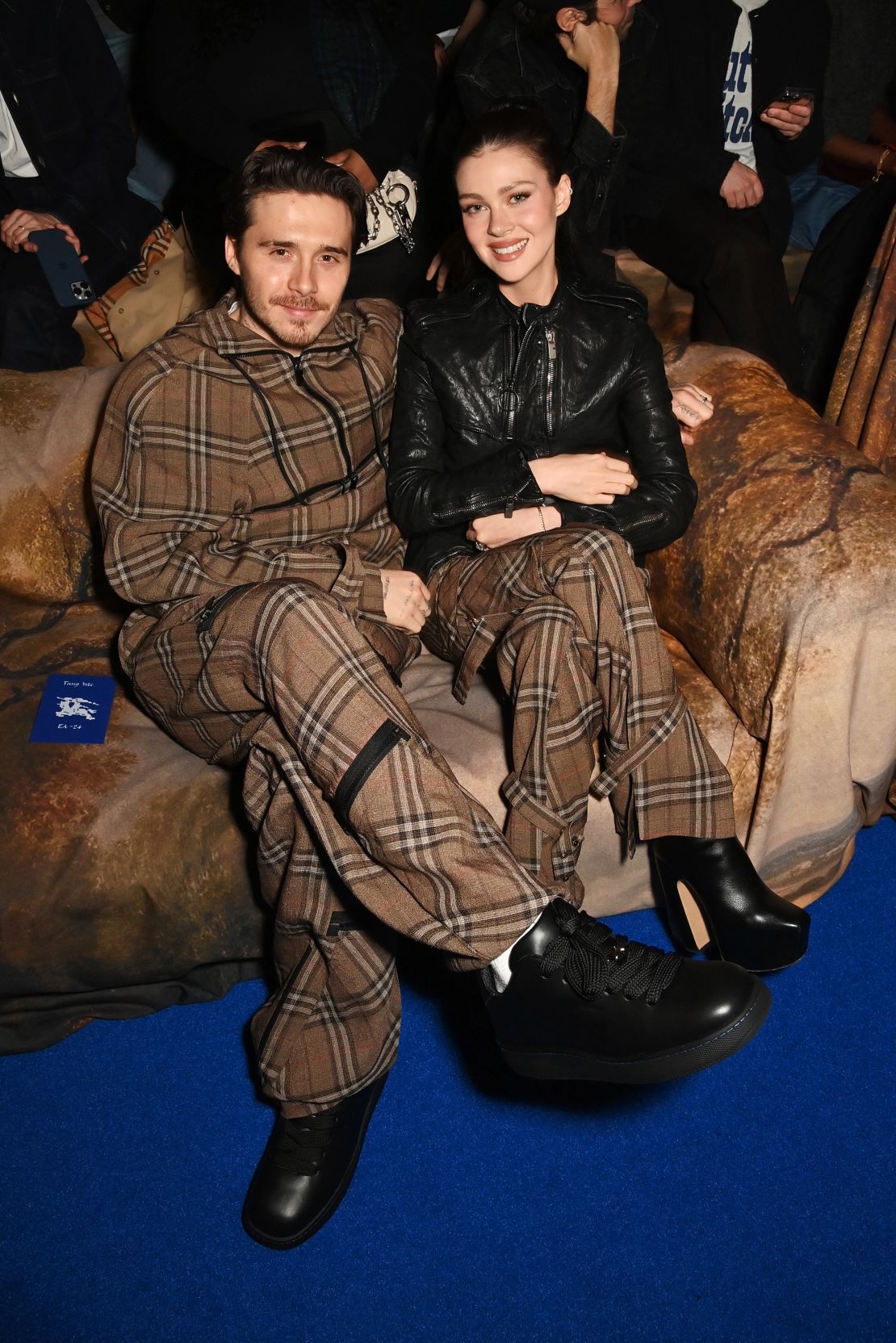 The star-studded front row included Brooklyn Beckham and wife Nicola Peltz, dressed in head-to-toe Burberry.