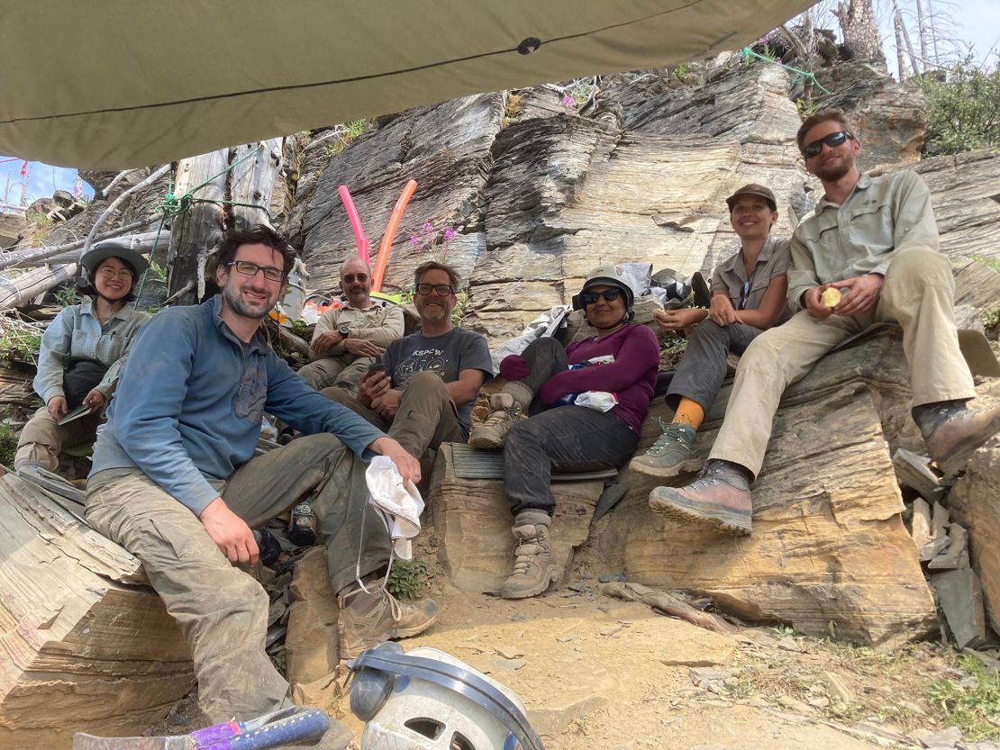 The research team will take a break while searching for fossils at Burgess Shale Rock Formation in British Columbia in 2022.