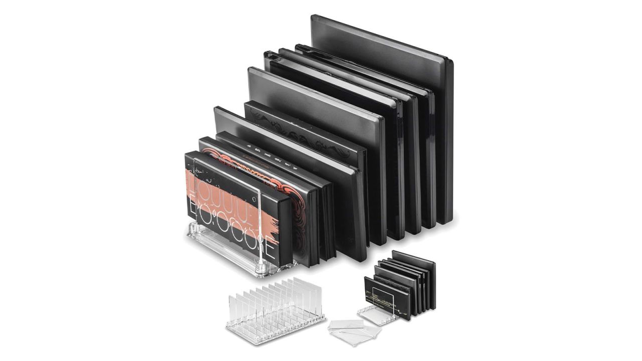 Numerous makeup palettes are organized in an acrylic orgainzer.